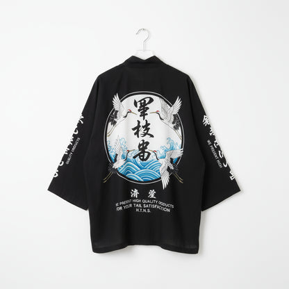 Black kimono-style garment with Japanese text and crane designs on a white background