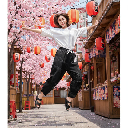 Black pants with white patterns on a white background